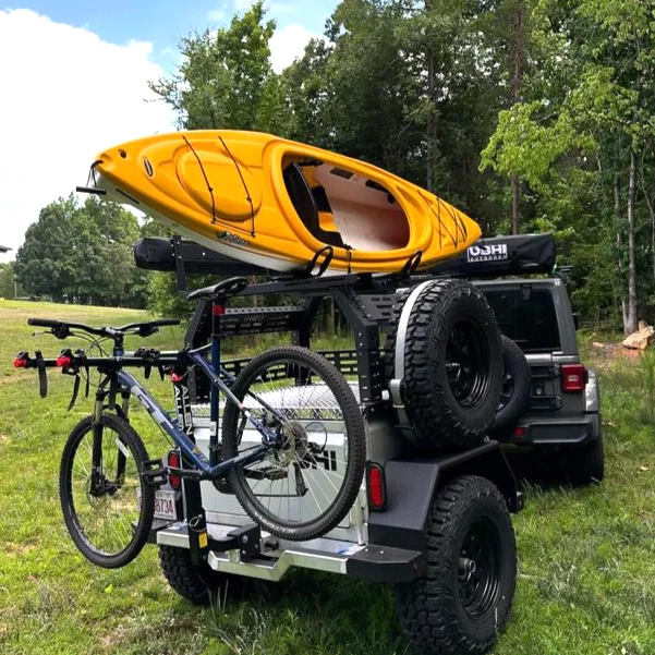 Trailer loaded with a kayak and bikes